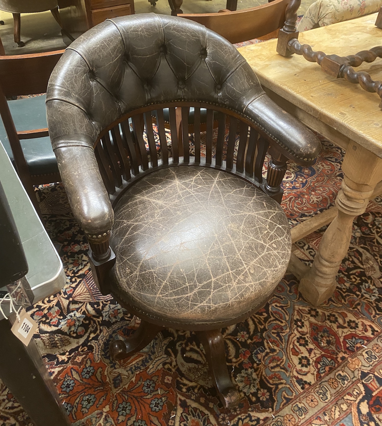 A Victorian mahogany buttoned brown leather swivel desk chair, width 63cm, depth 60cm, height 93cm